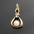 14k yellow gold pendant 1x diamond 1x freshwater cultured pearl 