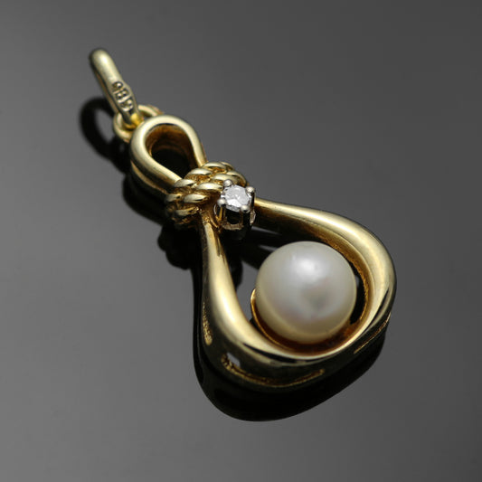 14k yellow gold pendant 1x diamond 1x freshwater cultured pearl 